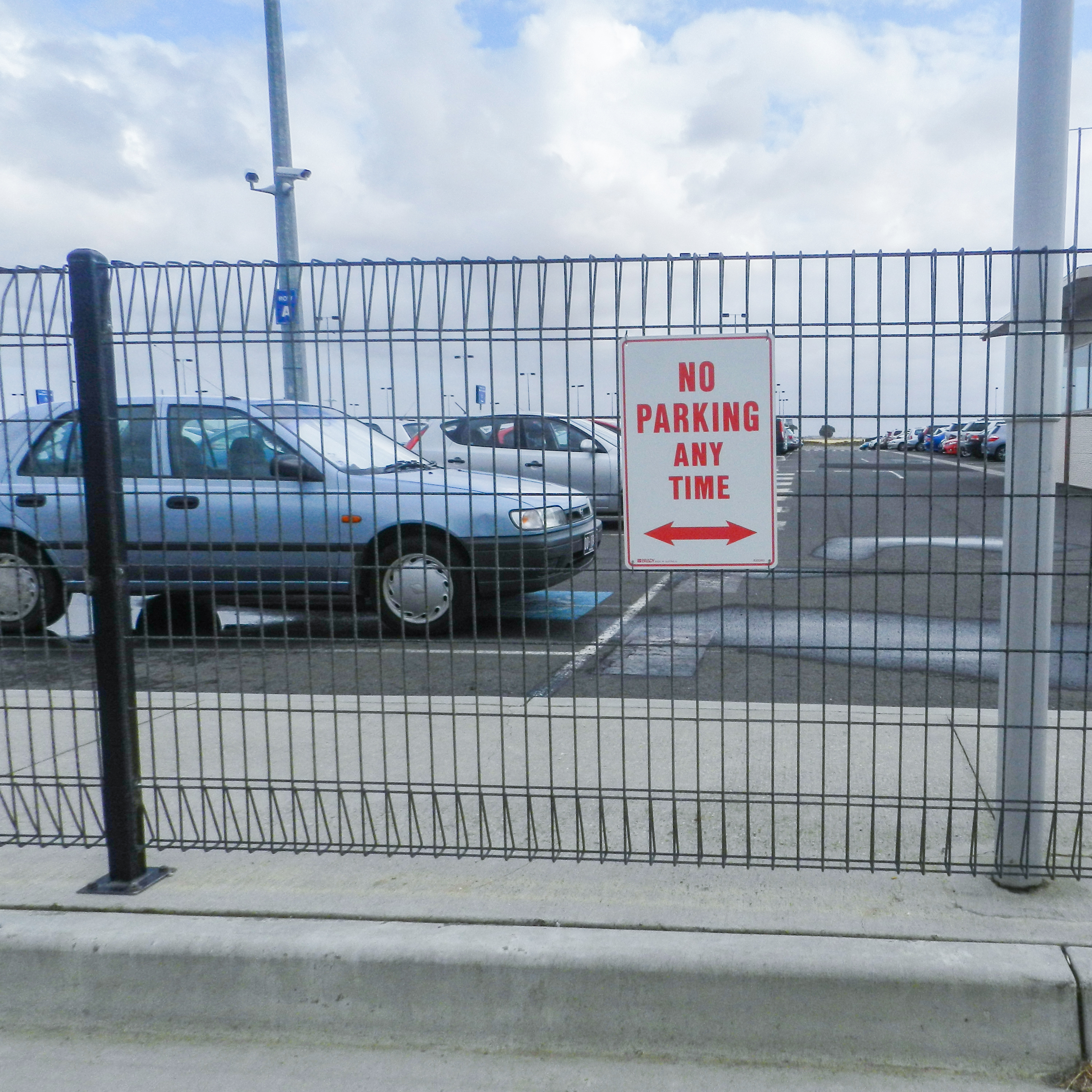 Roll top fence for parking