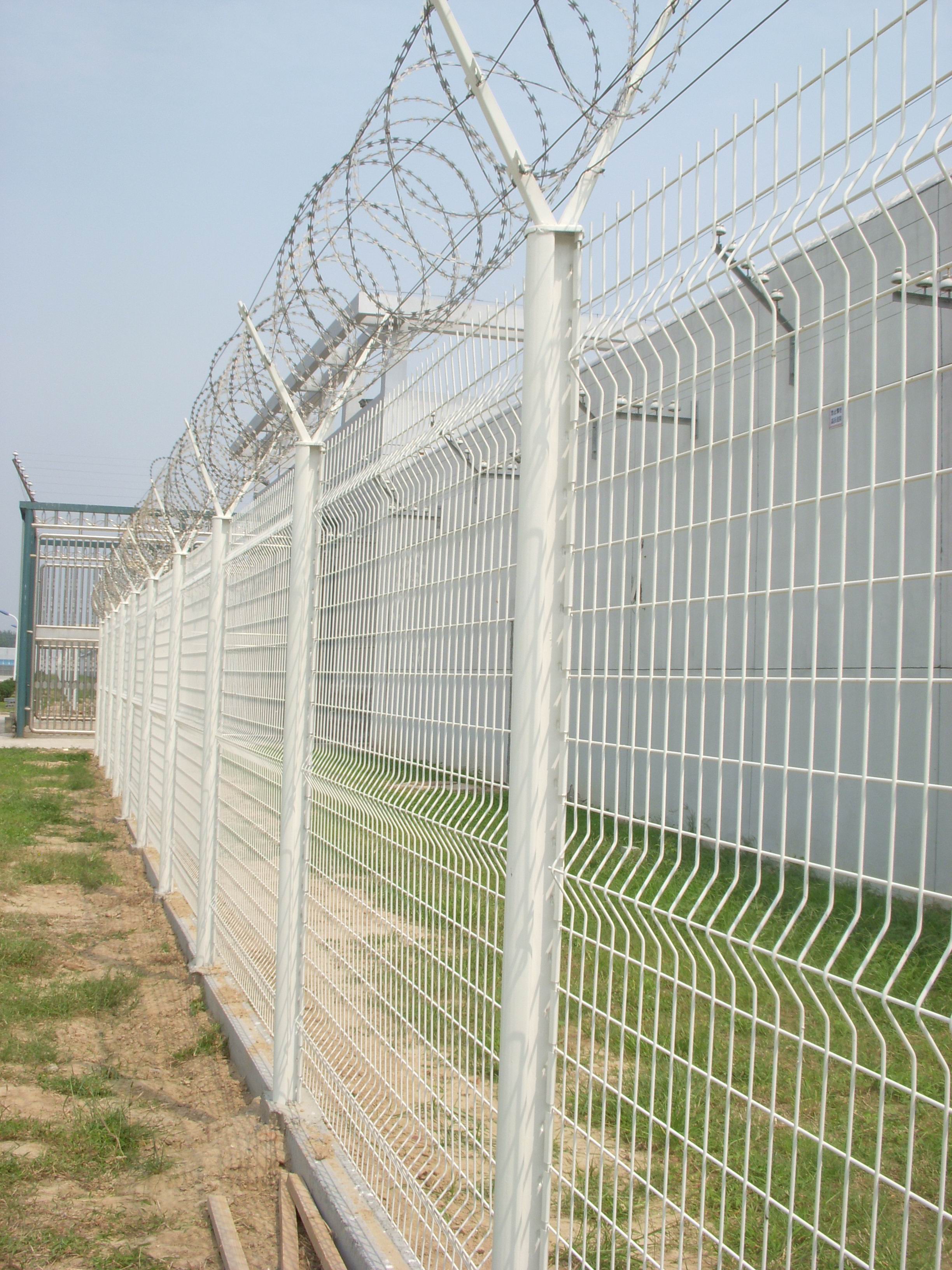 How tall is the average prison fence?